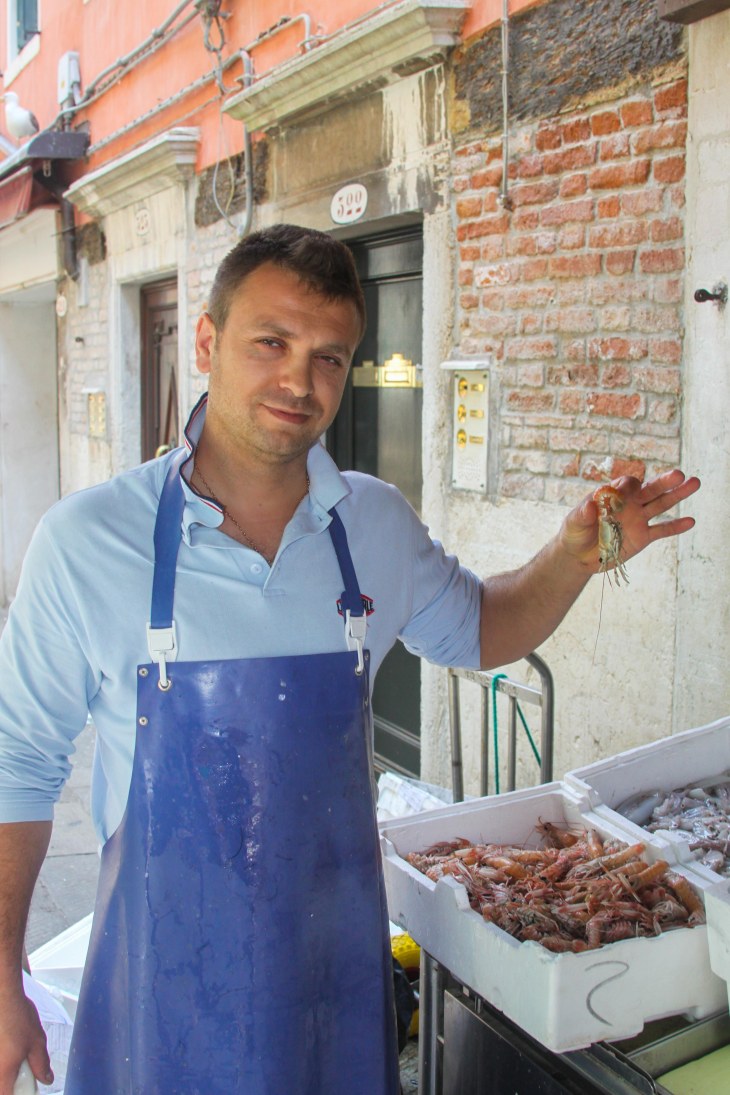 Vendor at Rialto Fish Market in Venice